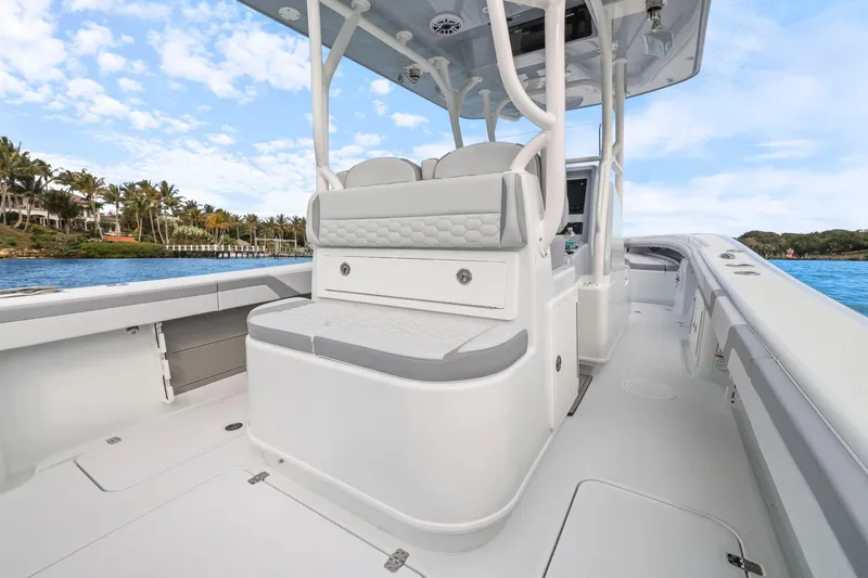  Yacht Photos Pics 2026 Yellowfin 32 Offshore boat interior with seating, ocean view, and clear sky.