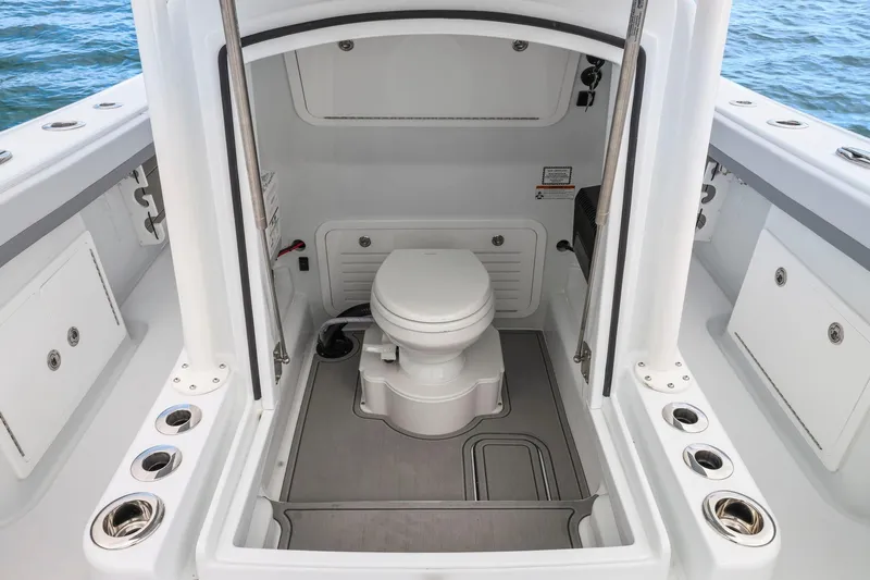  Yacht Photos Pics 2026 Yellowfin 32 Offshore boat interior with marine toilet, ocean view.