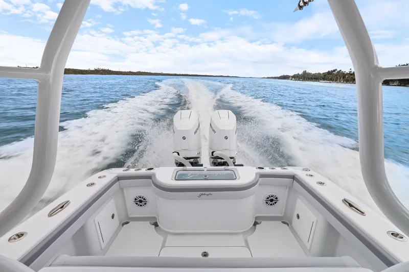  Yacht Photos Pics 2026 Yellowfin 32 Offshore boat cruising on open water, showcasing powerful twin engines.