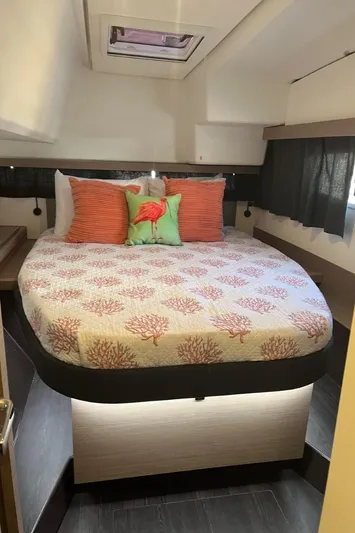 Scarlet Ibis Yacht Photos Pics 2023 Fountaine Pajot Isla 40 cabin with cozy bed and decorative pillows.