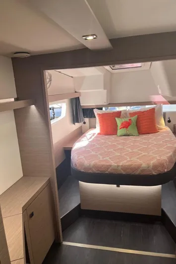Scarlet Ibis Yacht Photos Pics 2023 Fountaine Pajot Isla 40 cabin interior with bed, modern design, and natural lighting.