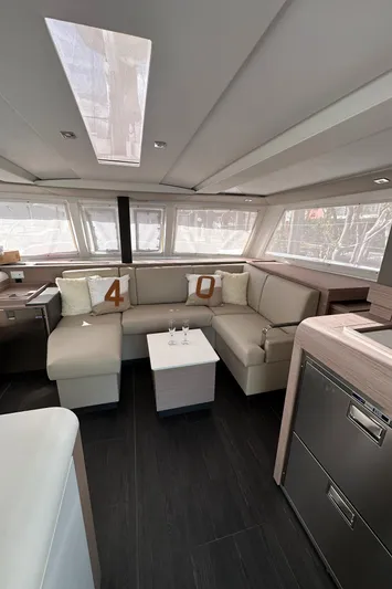 Scarlet Ibis Yacht Photos Pics 2023 Fountaine Pajot Isla 40 interior with modern seating and sleek design.