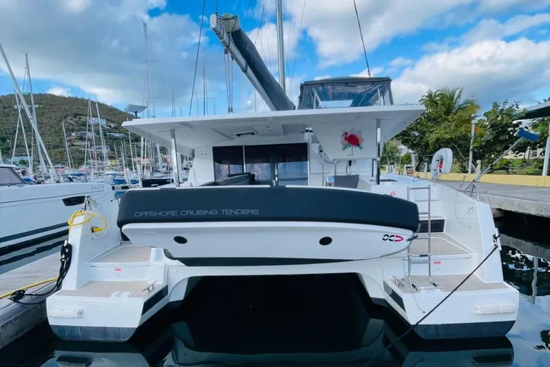 Scarlet Ibis Yacht Photos Pics 2023 Fountaine Pajot Isla 40 catamaran docked at marina, rear view.