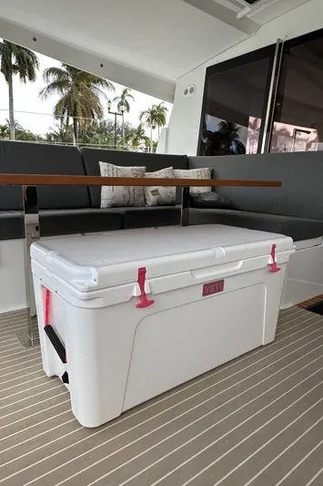 Scarlet Ibis Yacht Photos Pics 2023 Fountaine Pajot Isla 40 yacht interior with white cooler and seating area.