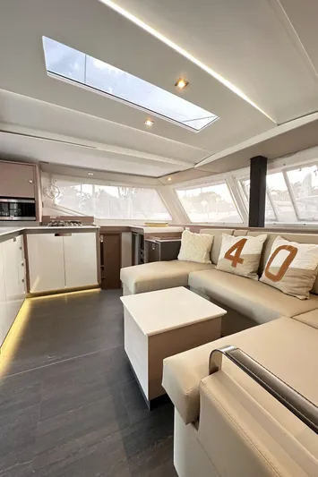 Scarlet Ibis Yacht Photos Pics 2023 Fountaine Pajot Isla 40 interior with modern design and spacious seating area.