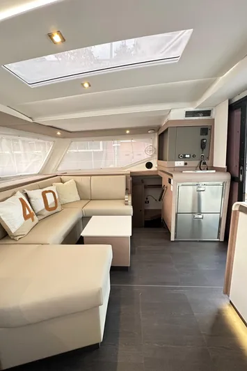 Scarlet Ibis Yacht Photos Pics Luxurious interior of 2023 Fountaine Pajot Isla 40 catamaran with modern furnishings.