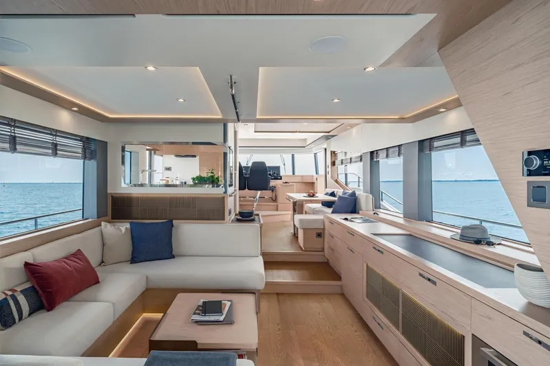  Yacht Photos Pics Luxurious interior of 2026 Beneteau Grand Trawler 63 yacht with modern furnishings and ocean view.