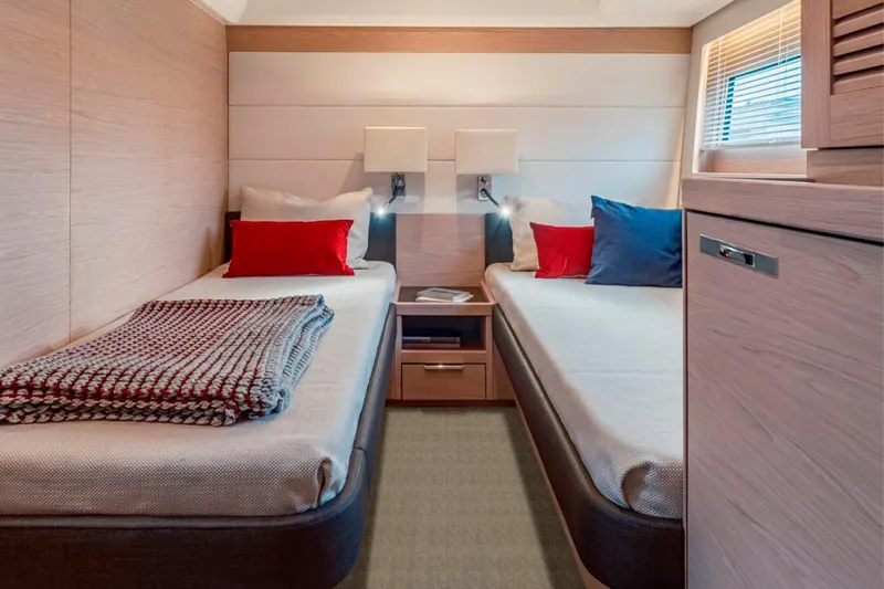  Yacht Photos Pics Luxurious twin cabin interior of 2026 Beneteau Grand Trawler 63 yacht, featuring modern design.