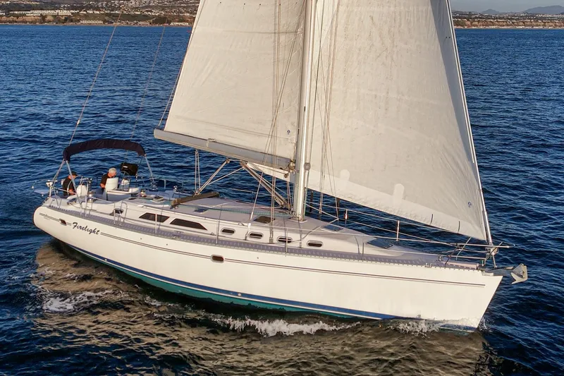 Firelight Yacht Photos Pics Sailing yacht Catalina 470, 1999 model, cruising on open water.