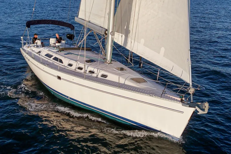 Firelight Yacht Photos Pics Sailing yacht Catalina 470, 1999 model, cruising on open water with full sails.