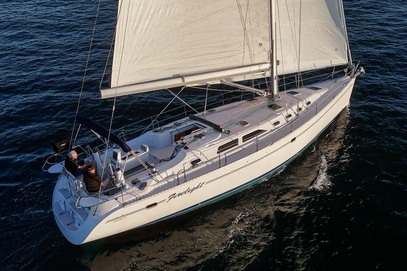 Firelight Yacht Photos Pics Sailing yacht Catalina 470, 1999 model, cruising on open water.