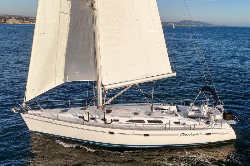 Firelight Yacht Photos Pics Sailing yacht Catalina 470, 1999 model, cruising on open sea.