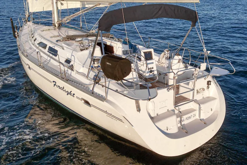 Firelight Yacht Photos Pics Sailing yacht Catalina 470, 1999 model, cruising on open water.