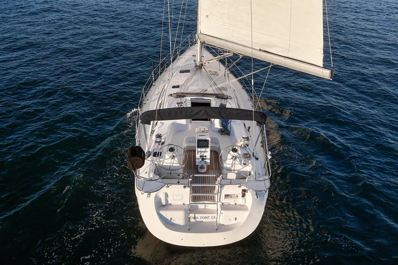 Firelight Yacht Photos Pics Sailing yacht Catalina 470, 1999 model, cruising on open water.