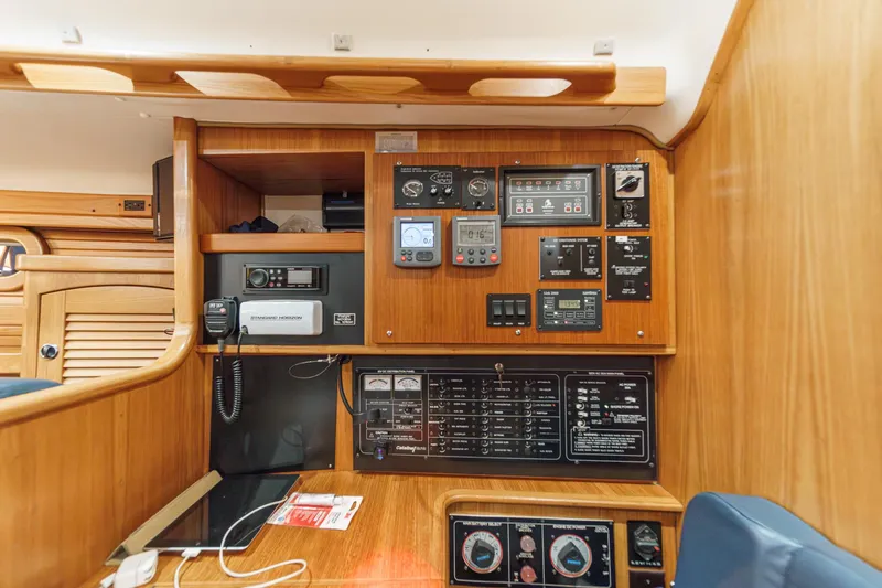 Firelight Yacht Photos Pics Control panel inside a 1999 Catalina 470 yacht, featuring navigation and communication equipment.