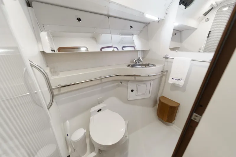 Firelight Yacht Photos Pics Bathroom interior of a 1999 Catalina 470 yacht, featuring modern fixtures and sleek design.