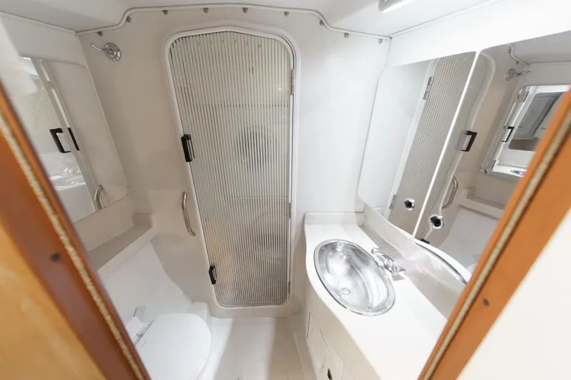 Firelight Yacht Photos Pics Bathroom interior of 1999 Catalina 470 yacht with shower, sink, and toilet.