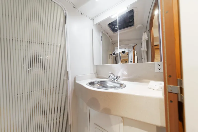 Firelight Yacht Photos Pics Bathroom interior of 1999 Catalina 470 yacht with sink and mirror.