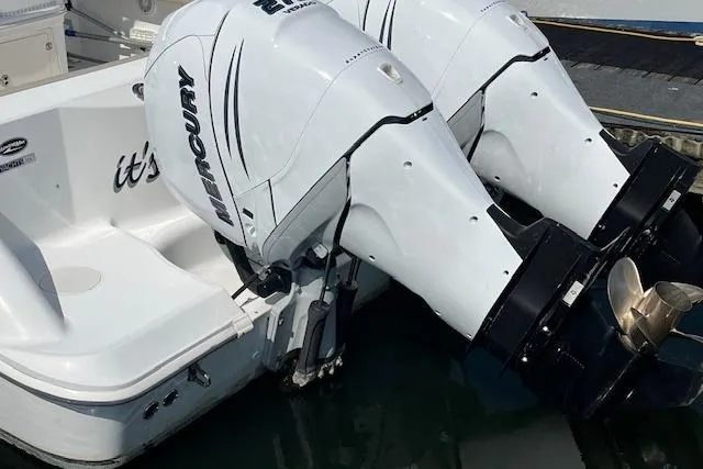  Yacht Photos Pics 2006 Boston Whaler 320 Outrage Cuddy Cabin with twin Mercury outboard engines.