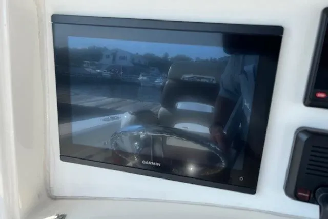  Yacht Photos Pics Garmin display on 2006 Boston Whaler 320 Outrage Cuddy Cabin boat dashboard.