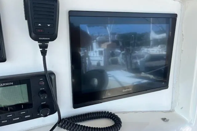  Yacht Photos Pics Garmin marine electronics on 2006 Boston Whaler 320 Outrage Cuddy Cabin dashboard.