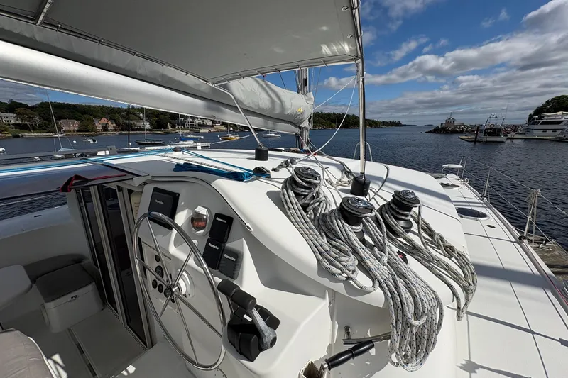 Littlest Hobo Yacht Photos Pics 2009 Fountaine Pajot Orana 44 Maestro catamaran docked, showcasing helm and rigging.