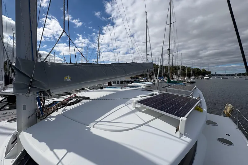 Littlest Hobo Yacht Photos Pics 2009 Fountaine Pajot Orana 44 Maestro catamaran with solar panels docked at marina.