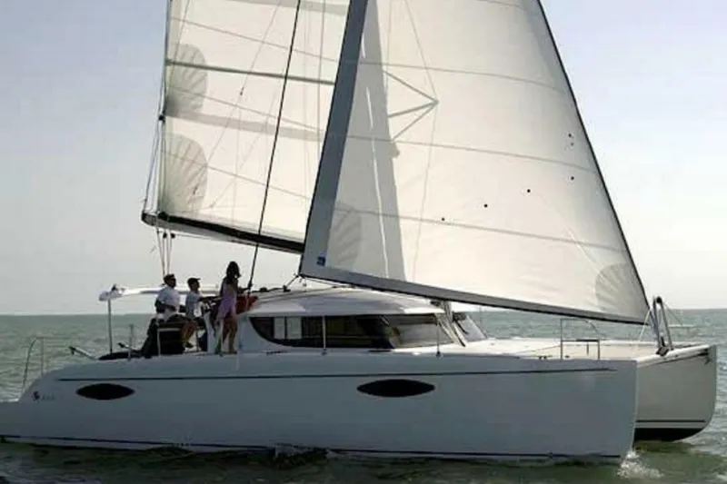 Littlest Hobo Yacht Photos Pics 2009 Fountaine Pajot Orana 44 Maestro sailing on open water.