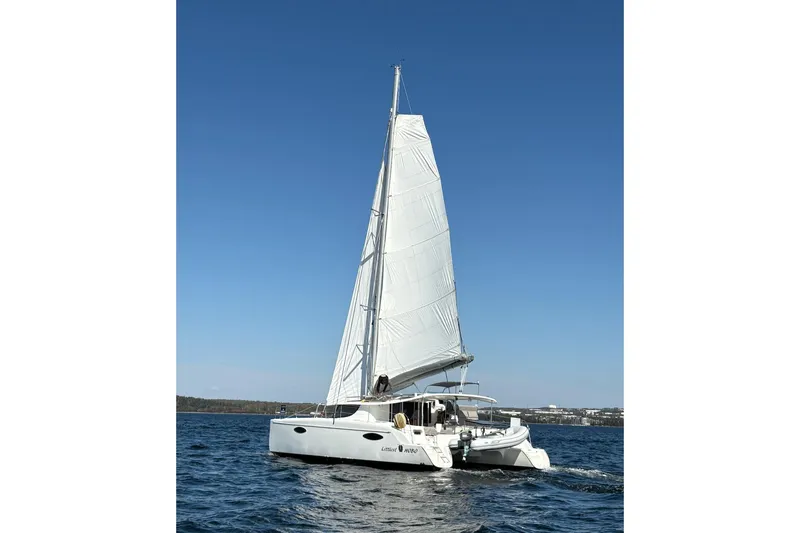 Littlest Hobo Yacht Photos Pics 2009 Fountaine Pajot Orana 44 Maestro sailing on open water under clear blue sky.