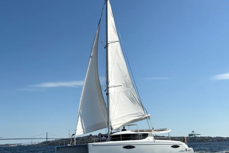 Littlest Hobo Yacht Photos Pics 2009 Fountaine Pajot Orana 44 Maestro sailing on open water under clear blue sky.