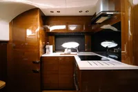 Luxurious kitchen interior of 2016 Princess V48 Open yacht with modern appliances.