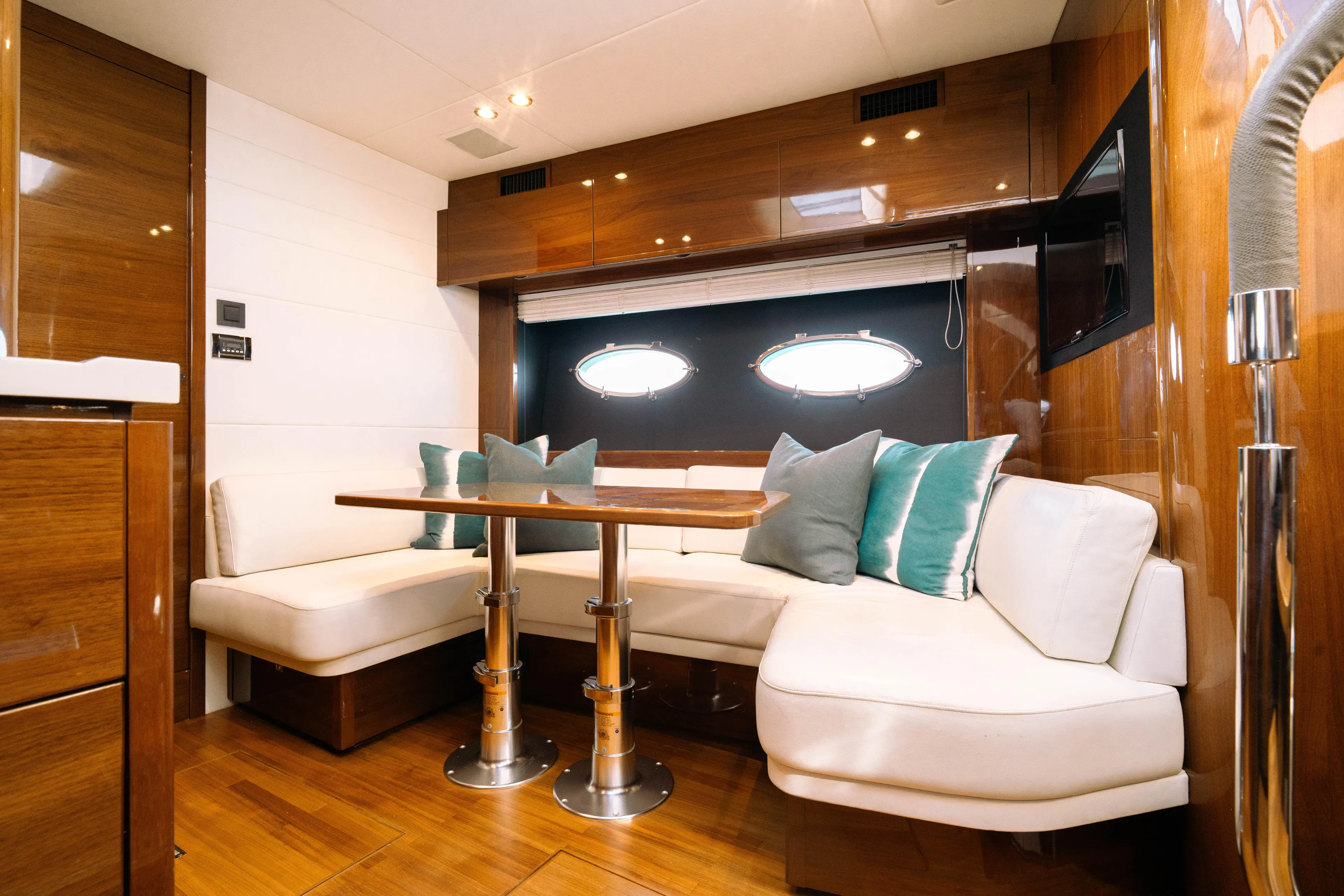 Luxurious interior of 2016 Princess V48 Open yacht with elegant seating and wooden finishes.