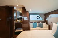 Luxurious interior of 2016 Princess V48 Open yacht with elegant wood finishes and modern decor.