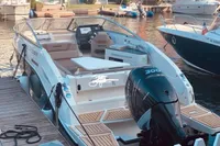 2016 Quicksilver Activ 805 Sundeck boat docked with powerful outboard motor.