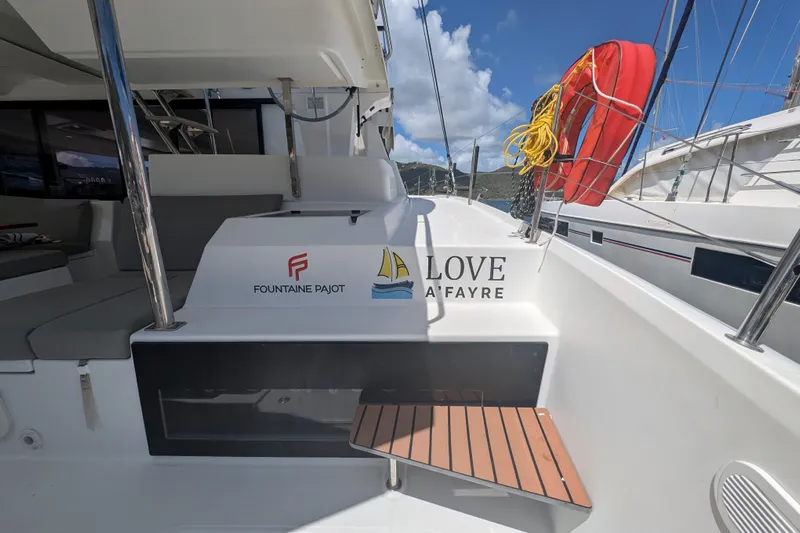 Love A Fayre Yacht Photos Pics 2020 Fountaine Pajot Astrea 42 catamaran deck with seating and safety equipment.