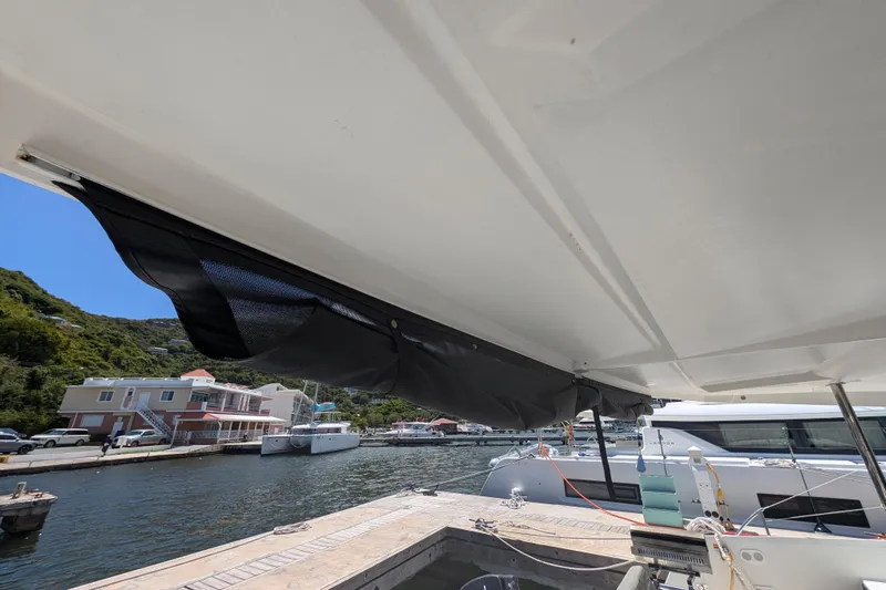 Love A Fayre Yacht Photos Pics Fountaine Pajot Astrea 42 yacht docked, showcasing awning and marina view, 2020 model.