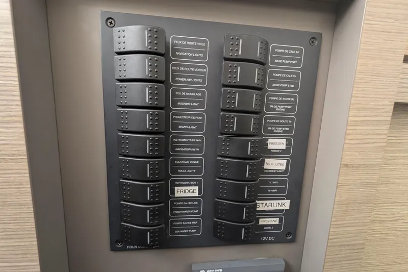 Love A Fayre Yacht Photos Pics Control panel of a 2020 Fountaine Pajot Astrea 42 catamaran, featuring labeled switches.
