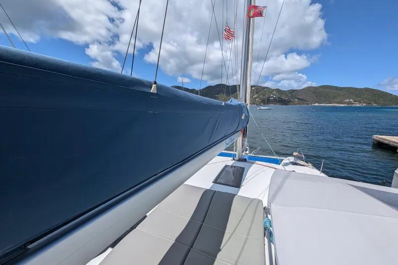 Love A Fayre Yacht Photos Pics 2020 Fountaine Pajot Astrea 42 catamaran on water, featuring sails and scenic coastal view.