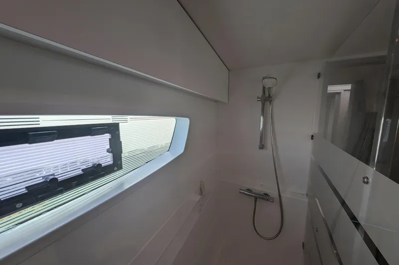 Love A Fayre Yacht Photos Pics Interior of 2020 Fountaine Pajot Astrea 42 yacht bathroom with shower and window.