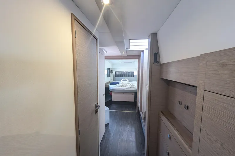 Love A Fayre Yacht Photos Pics Interior of 2020 Fountaine Pajot Astrea 42 catamaran, featuring modern wood finishes and cozy cabin.