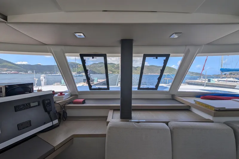 Love A Fayre Yacht Photos Pics Interior view of 2020 Fountaine Pajot Astrea 42 catamaran with scenic ocean backdrop.