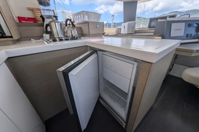 Love A Fayre Yacht Photos Pics Modern kitchen in 2020 Fountaine Pajot Astrea 42 yacht with open fridge and appliances.