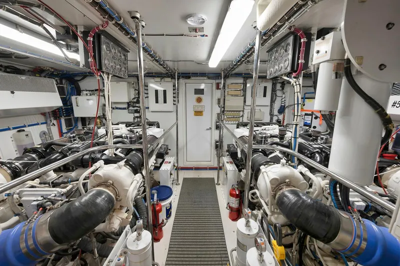 Copper Yacht Photos Pics Engine room of 2002 Hatteras 75 Cockpit Motor Yacht, showcasing machinery and equipment.