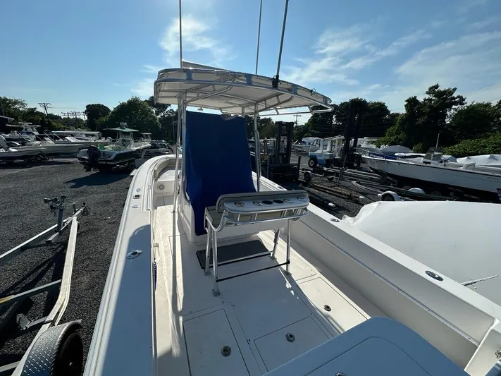  Yacht Photos Pics 2013 Contender 28 Tournament boat docked at a marina under clear skies.