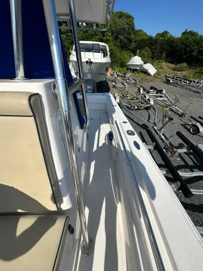  Yacht Photos Pics 2013 Contender 28 Tournament boat docked with trailers in the background.