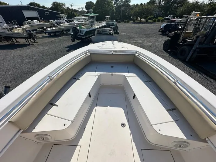  Yacht Photos Pics 2013 Contender 28 Tournament boat bow view at a marina.