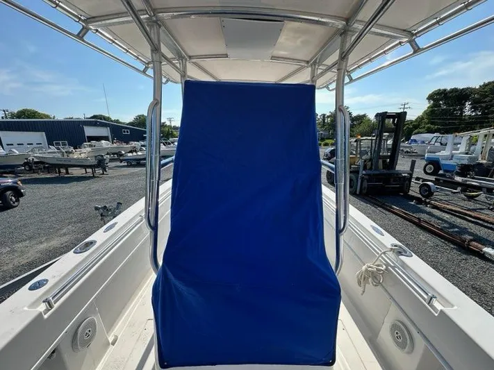  Yacht Photos Pics 2013 Contender 28 Tournament boat with blue cover, docked in a marina.