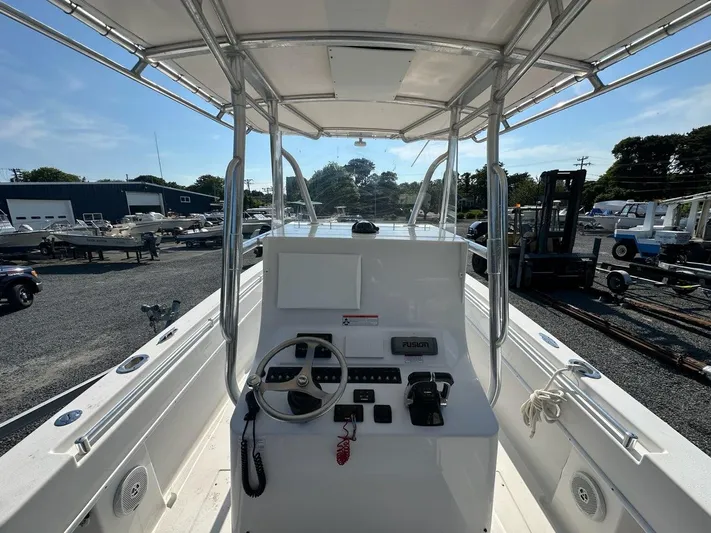  Yacht Photos Pics 2013 Contender 28 Tournament boat console with steering wheel and electronics.
