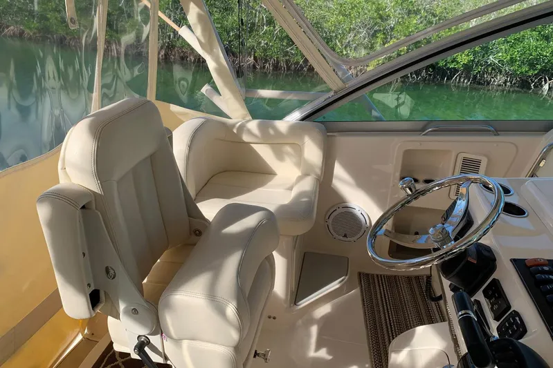  Yacht Photos Pics Interior of 2015 Grady-White Express 370 boat with steering wheel and seating.