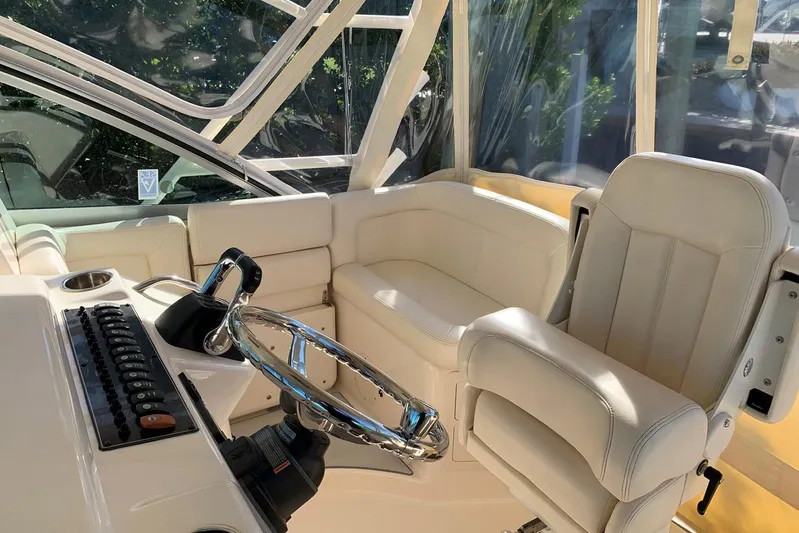  Yacht Photos Pics 2015 Grady-White Express 370 helm with luxurious seating and modern controls.